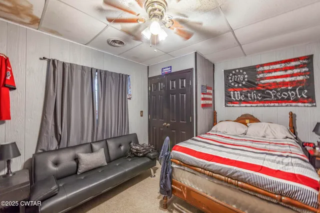 a bathroom with a sink a toilet and shower curtain