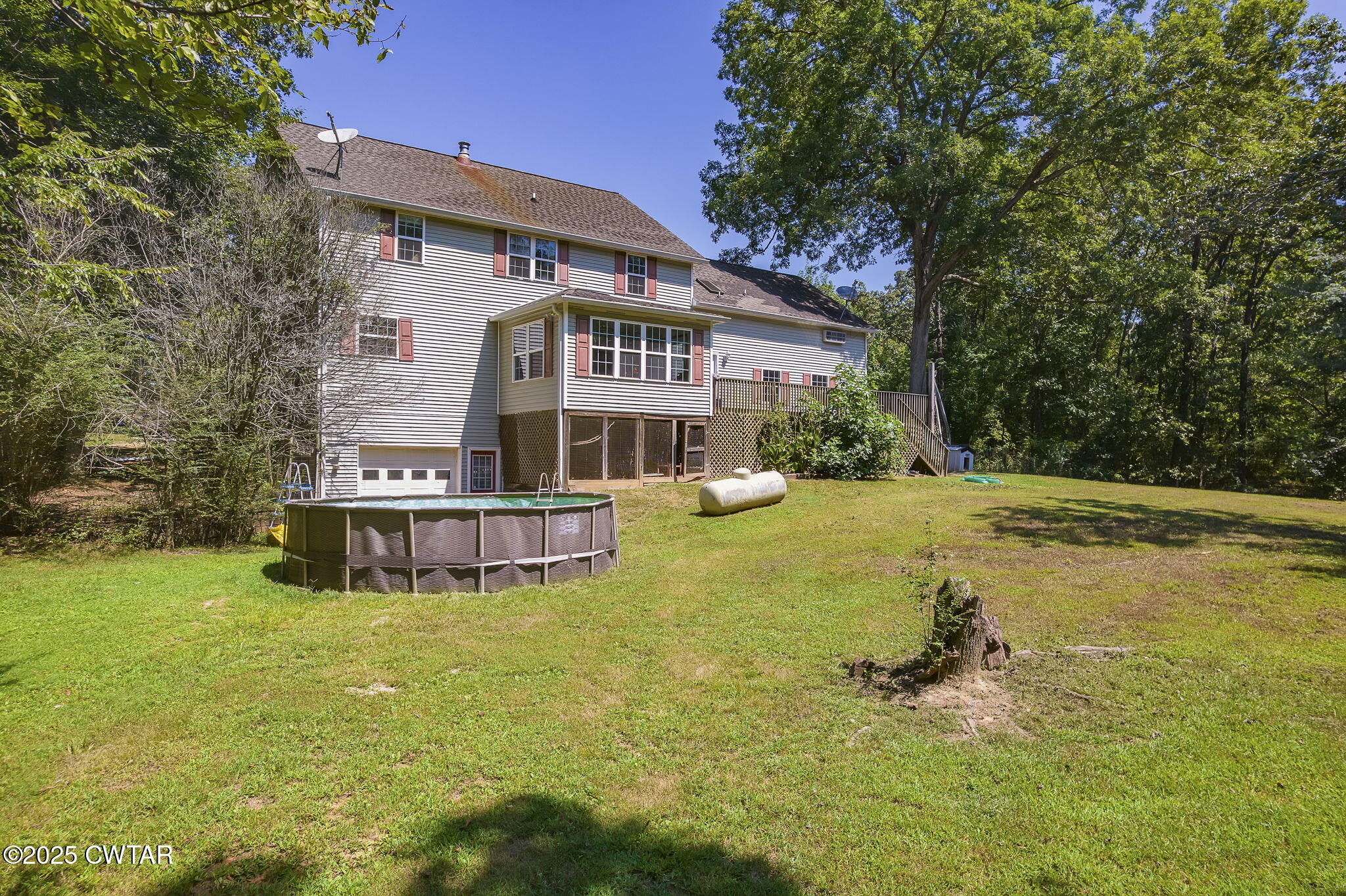50 Braund Road Finger, TN 38334 - Photo 41 of 65 a view of a house with a big yard and large trees