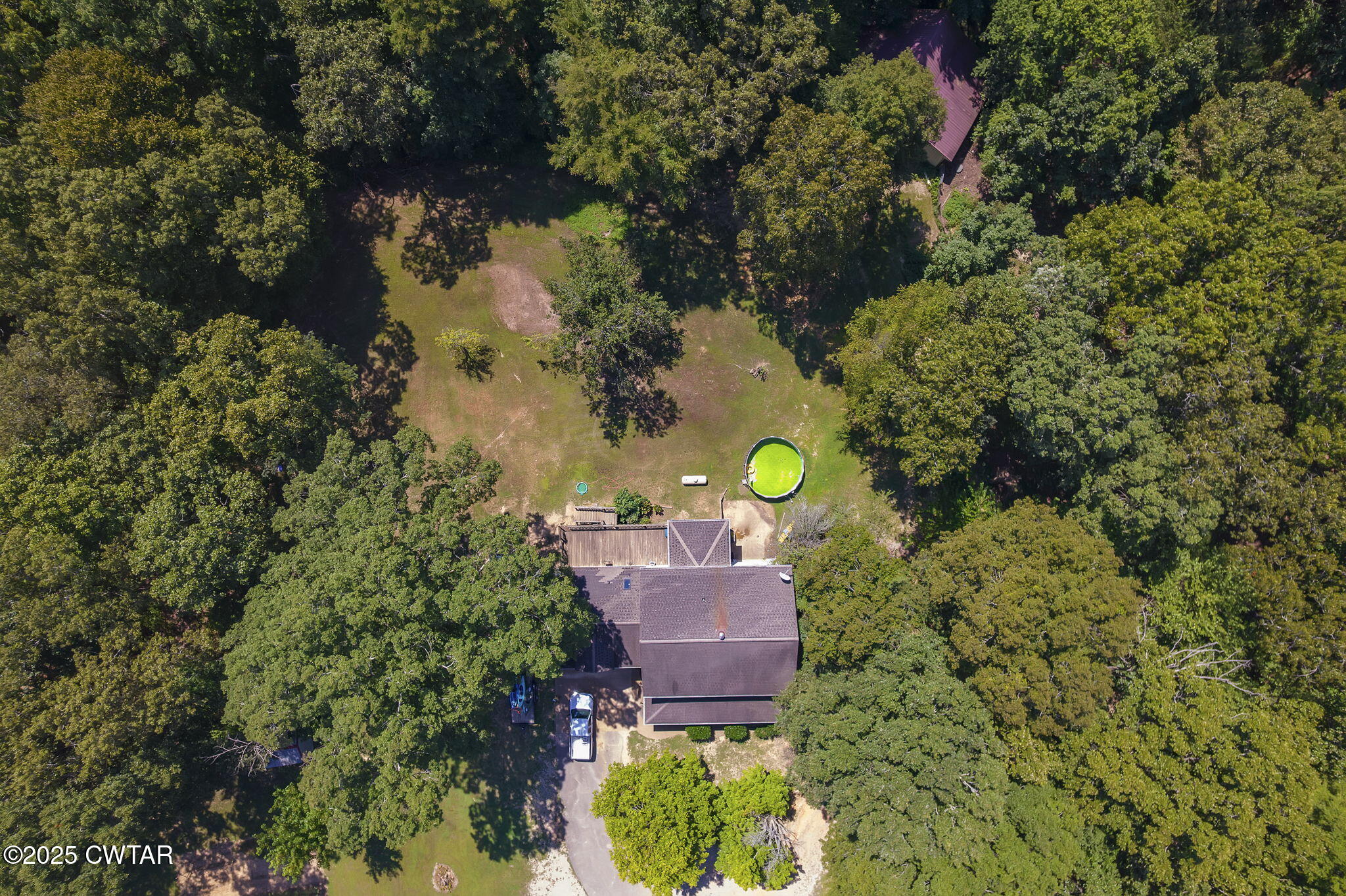 50 Braund Road Finger, TN 38334 - Photo 44 of 65 an aerial view of a house with a yard and lake view