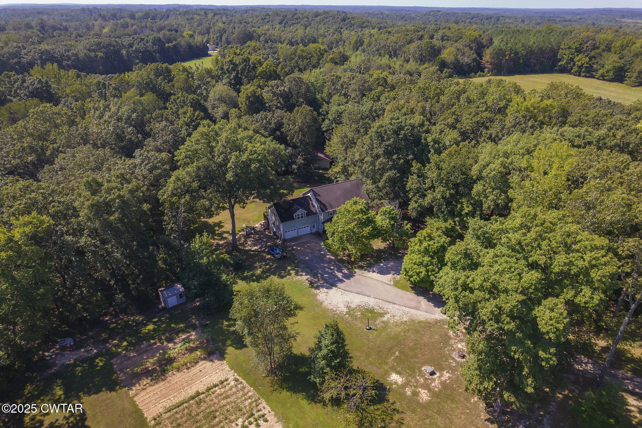 50 Braund Road Finger, TN 38334 - Photo 46 of 65 an aerial view of a house with a yard