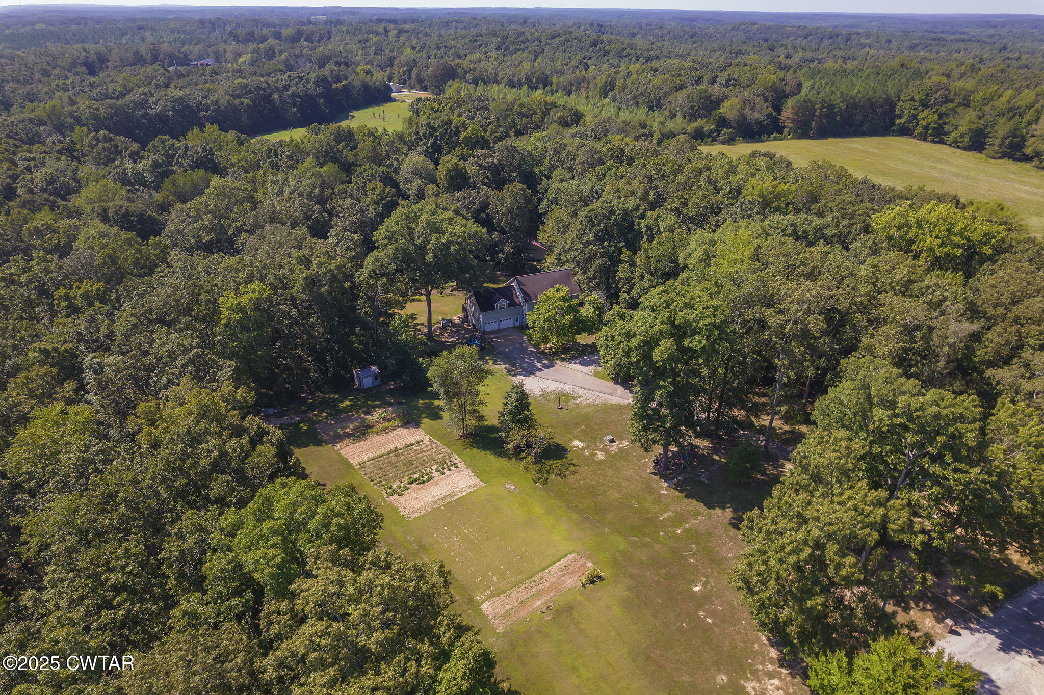 50 Braund Road Finger, TN 38334 - Photo 49 of 65 an aerial view of a house with a yard