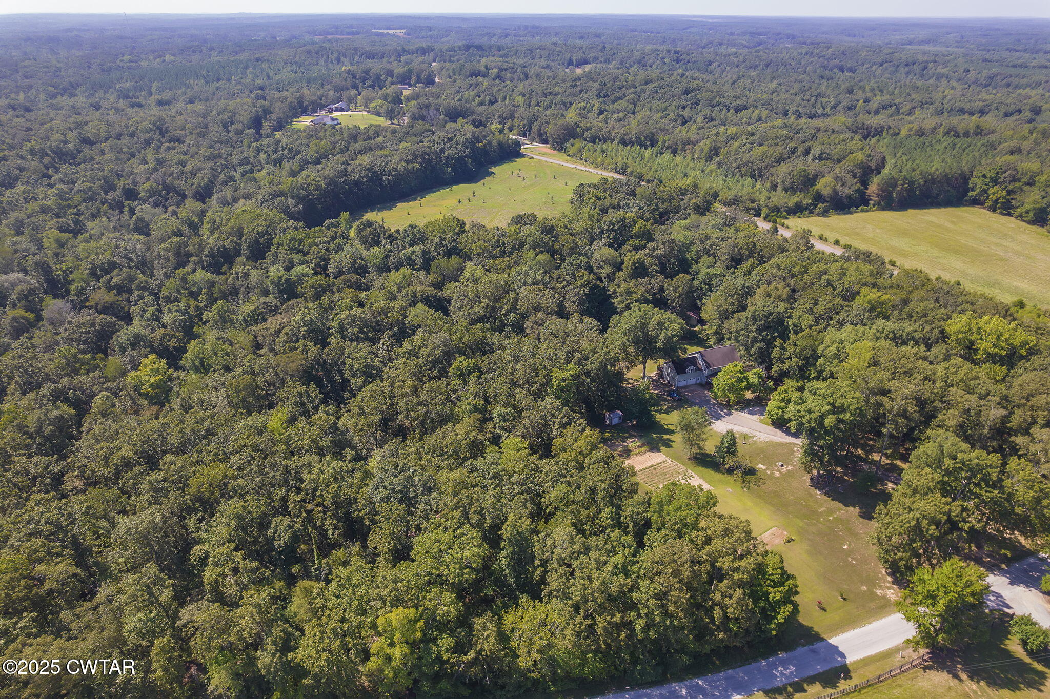 50 Braund Road Finger, TN 38334 - Photo 50 of 65 an aerial view of residential house with green space and mountain view in back
