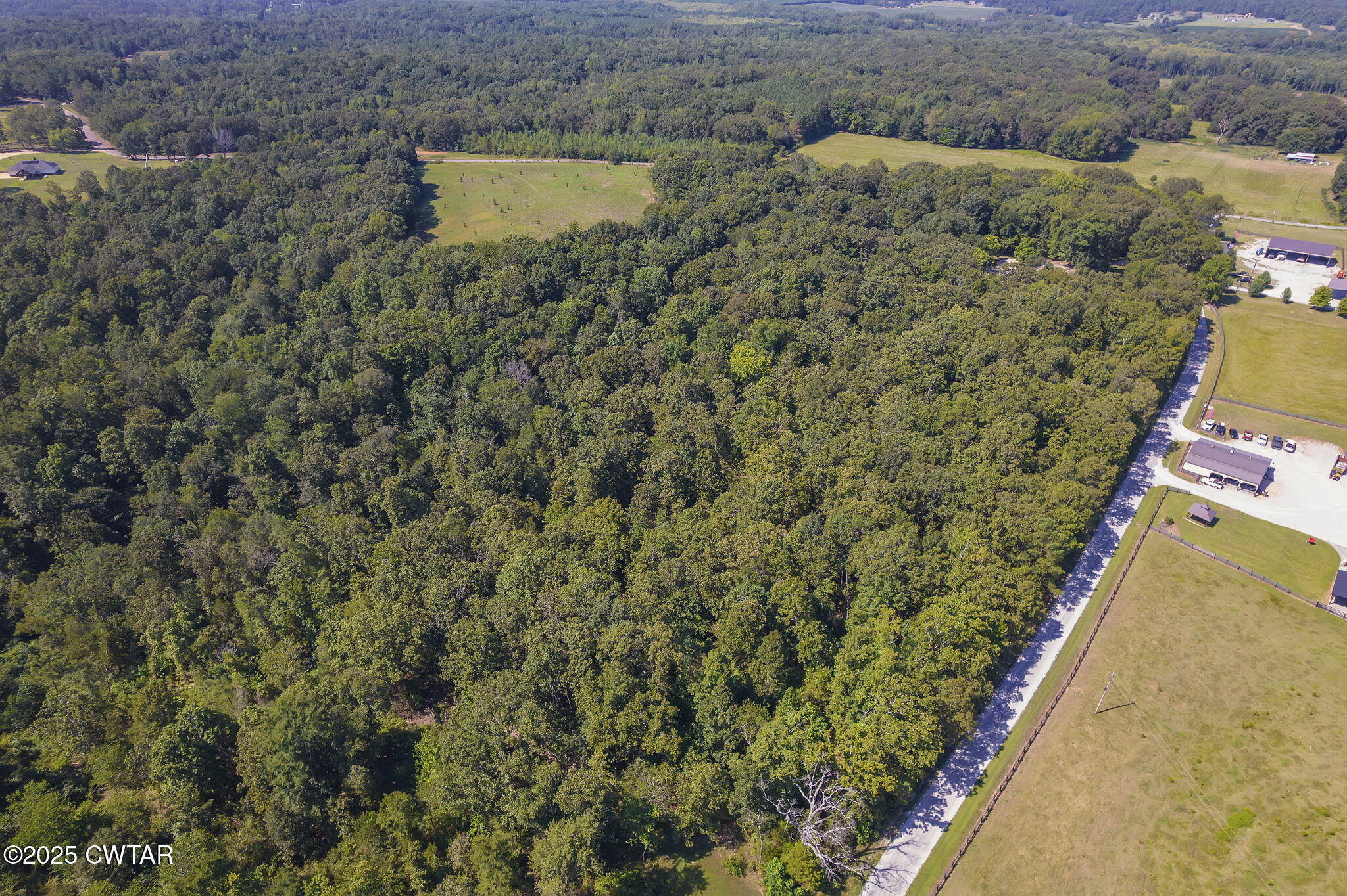 50 Braund Road Finger, TN 38334 - Photo 52 of 65 an aerial view of a house with a yard and lake view