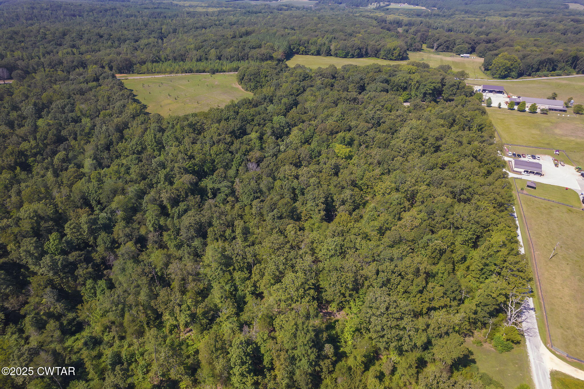 50 Braund Road Finger, TN 38334 - Photo 53 of 65 an aerial view of a house with a yard and lake view
