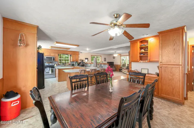 a dining room with furniture and window