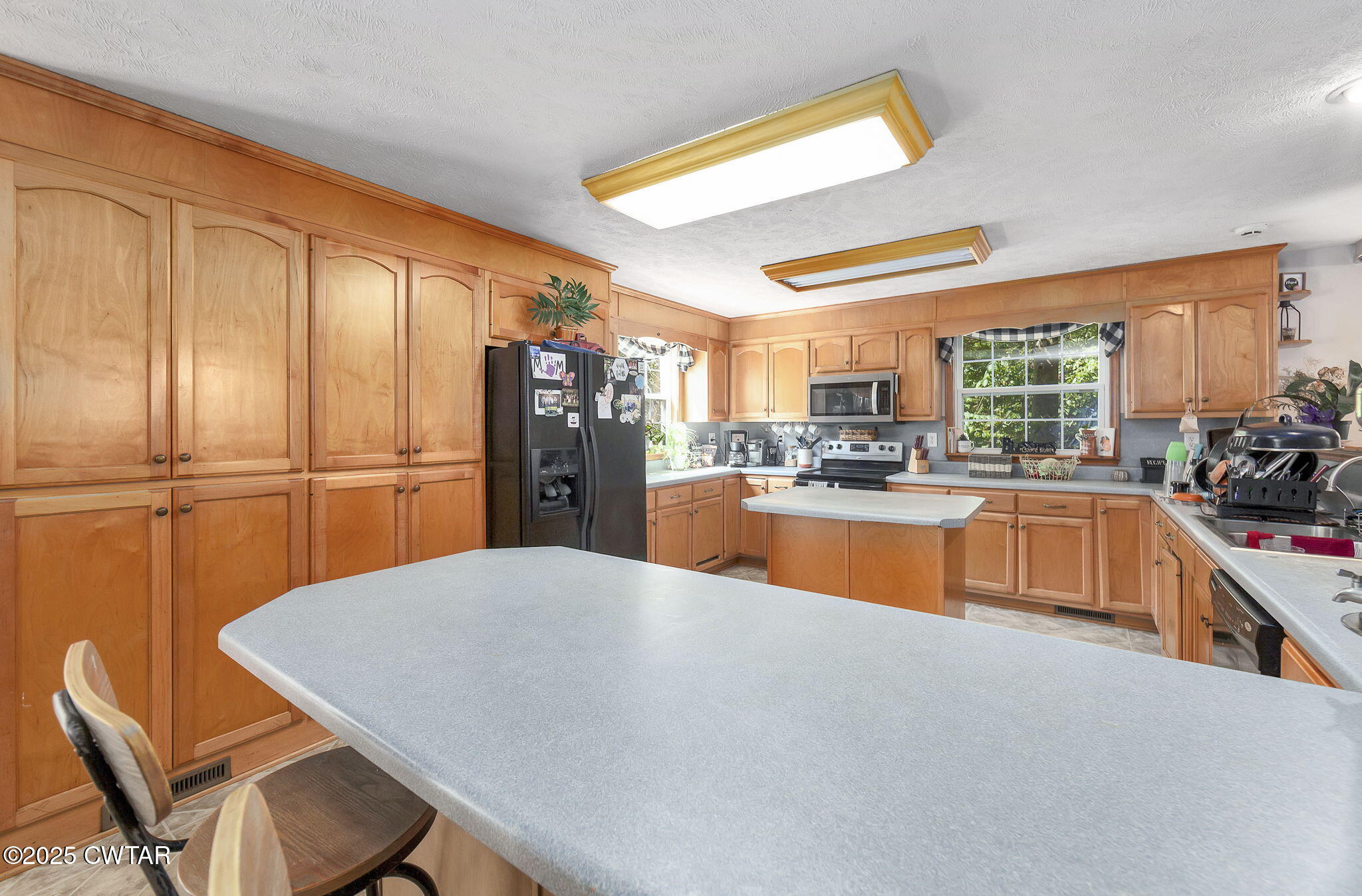 50 Braund Road Finger, TN 38334 - Photo 10 of 65 a kitchen with stainless steel appliances wooden floor and a refrigerator