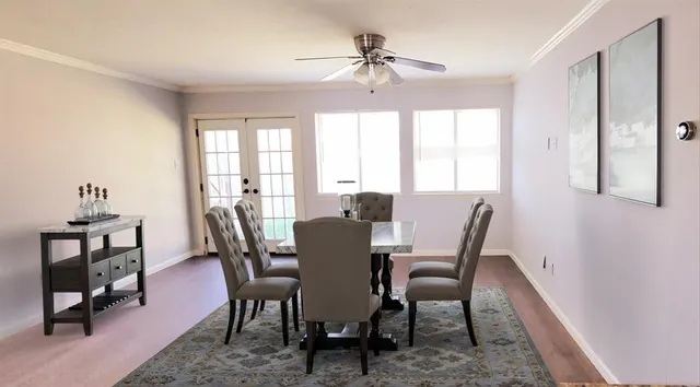 a view of a dining room with furniture window and outside view