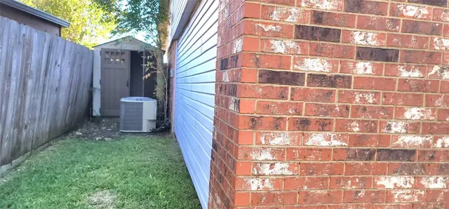 a kitchen with cabinets and wooden floor