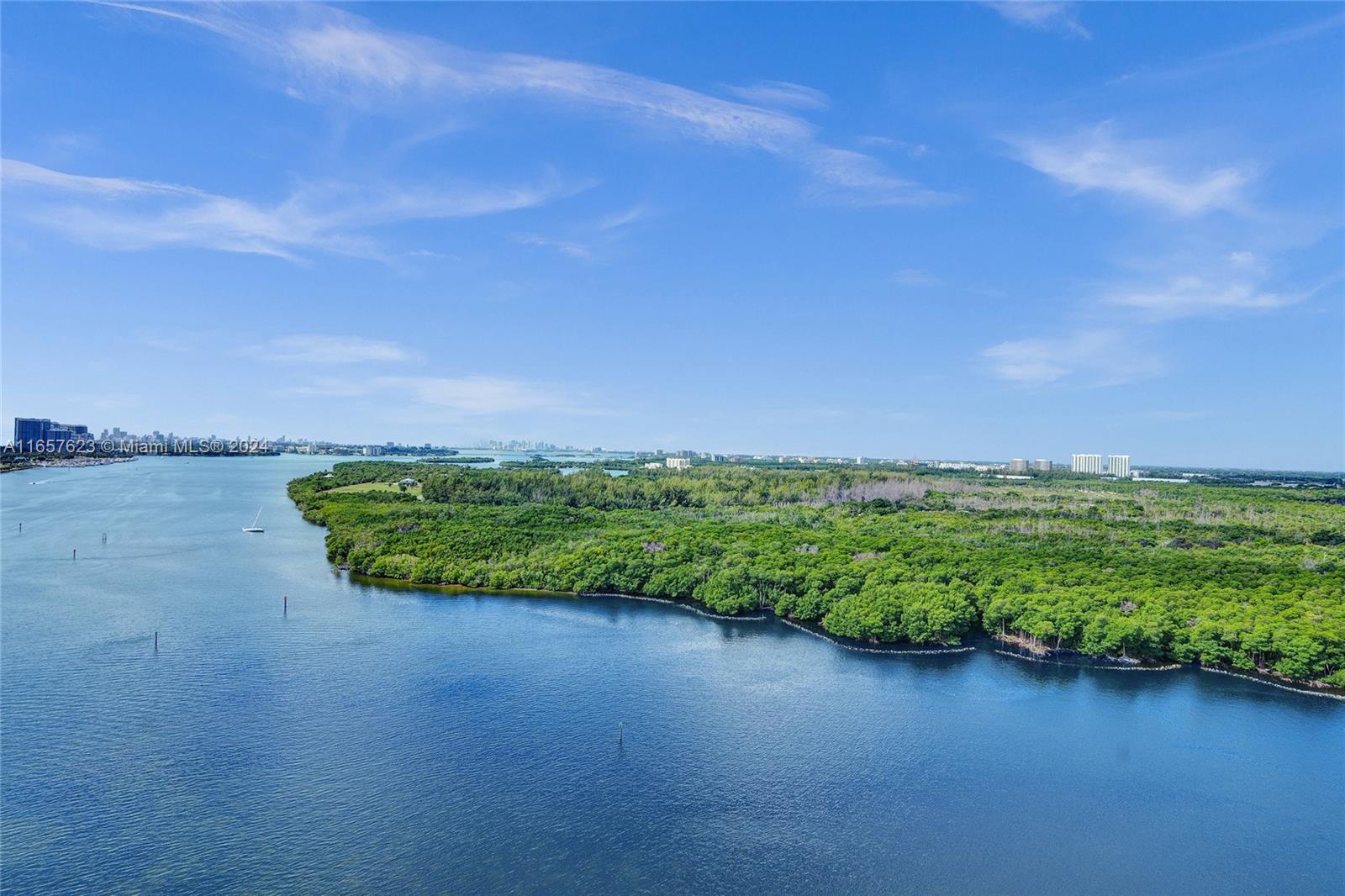 500 Bayview Drive, Unit PH20 Sunny Isles Beach, FL 33160 - Photo 1 of 41 a view of a garden with a building in the background