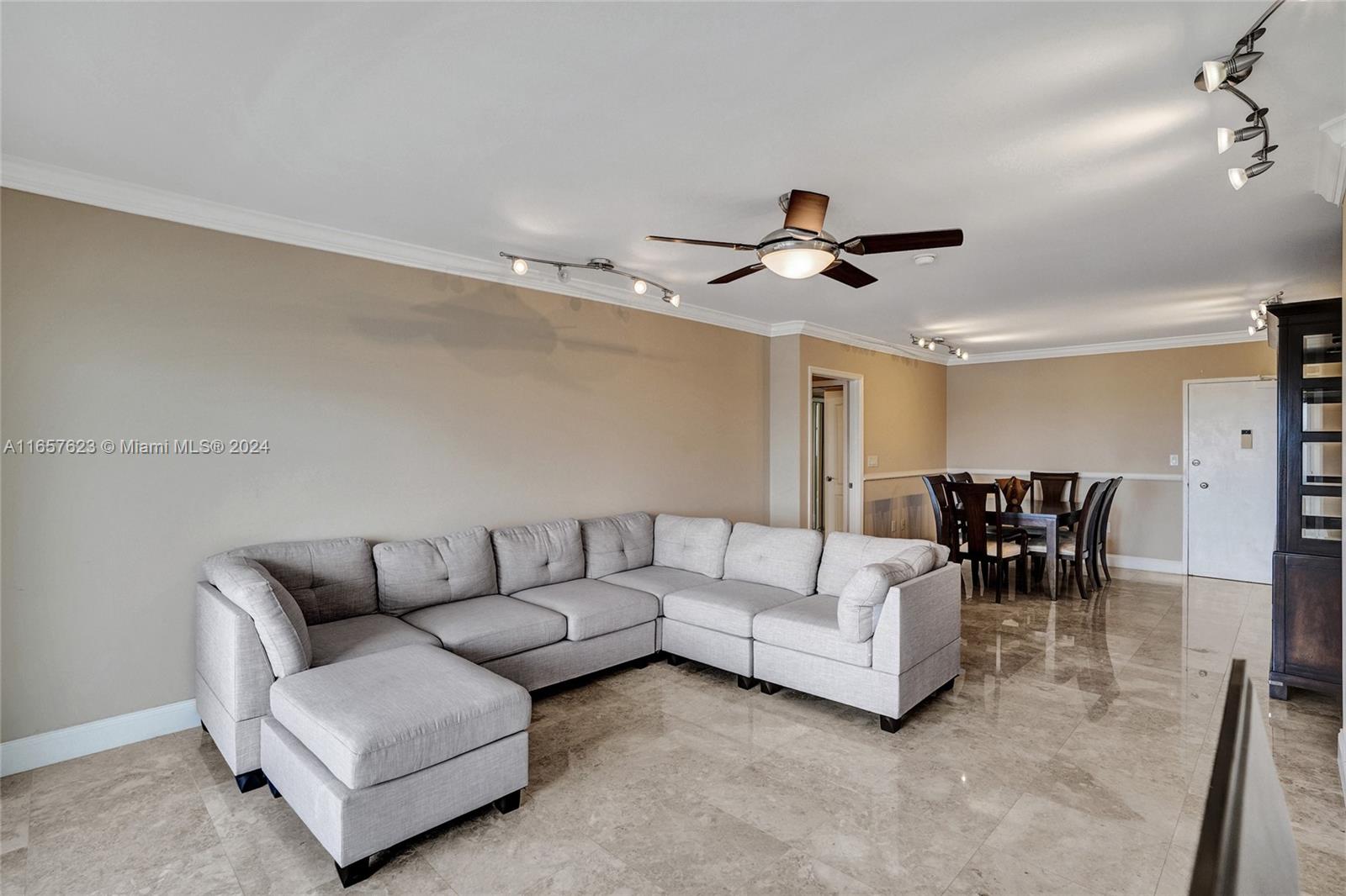 500 Bayview Drive, Unit PH20 Sunny Isles Beach, FL 33160 - Photo 12 of 41 a living room with furniture and a ceiling fan