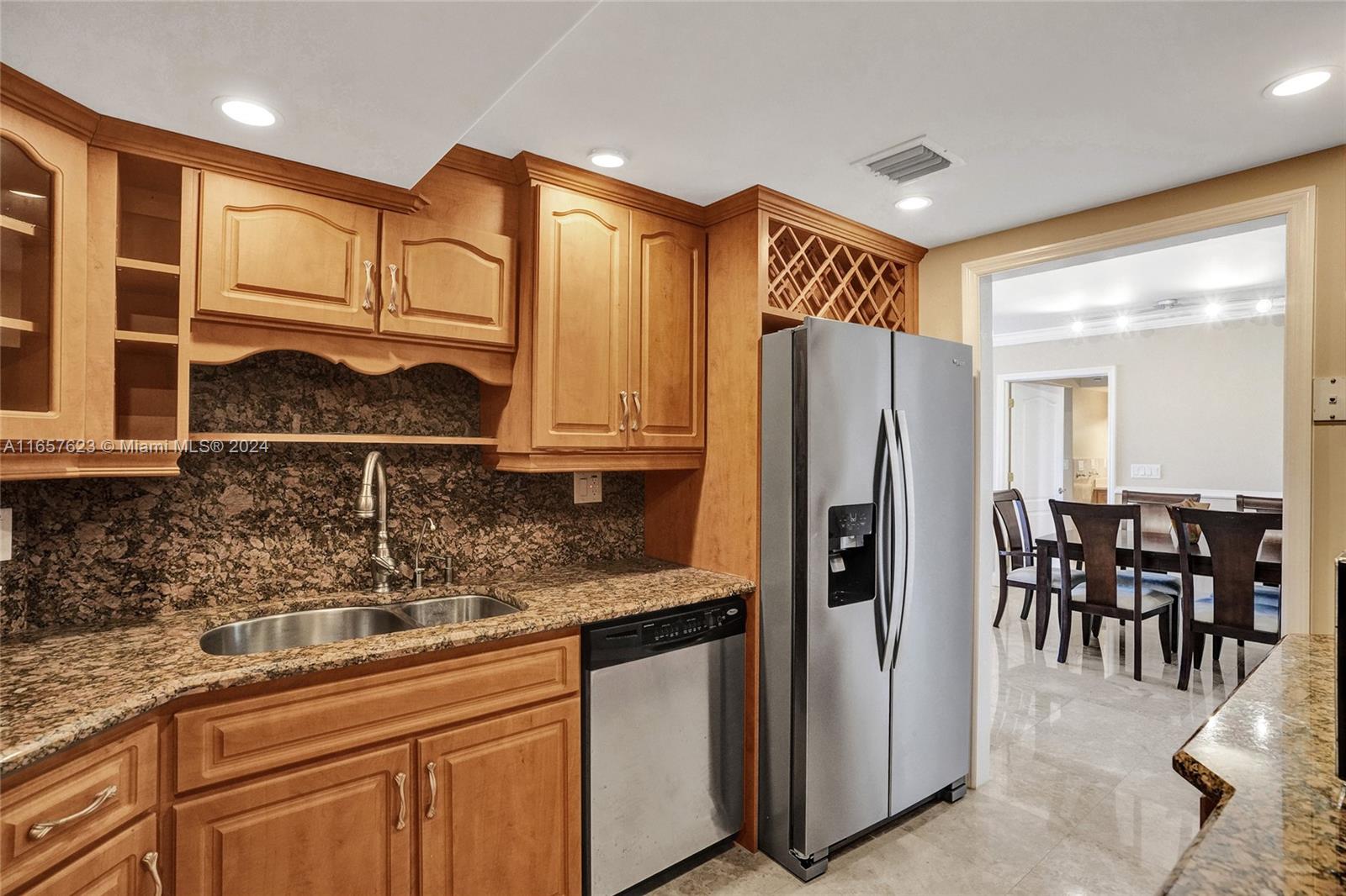 500 Bayview Drive, Unit PH20 Sunny Isles Beach, FL 33160 - Photo 17 of 41 a kitchen with stainless steel appliances granite countertop a refrigerator and cabinets