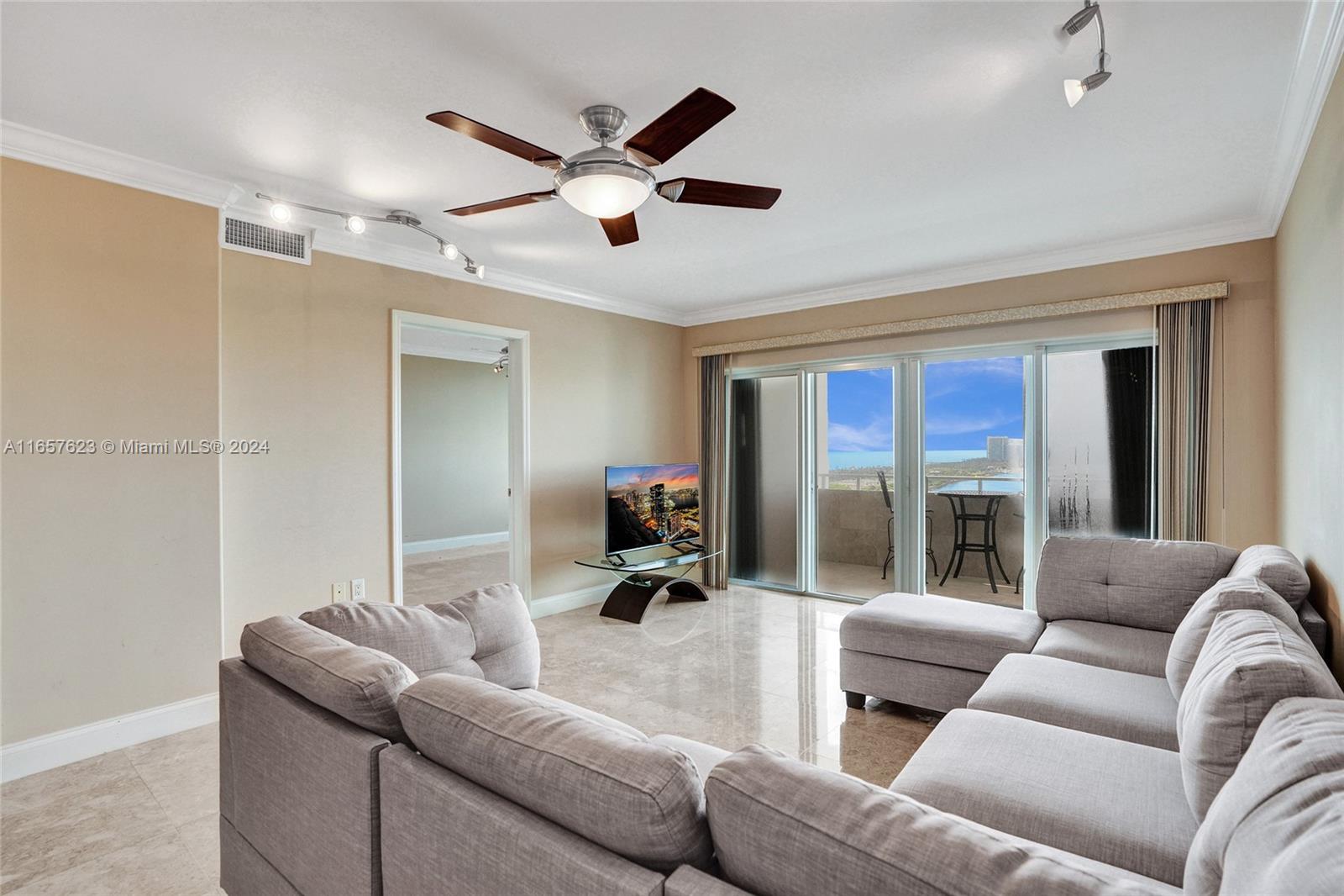 500 Bayview Drive, Unit PH20 Sunny Isles Beach, FL 33160 - Photo 27 of 41 a living room with furniture and a large window
