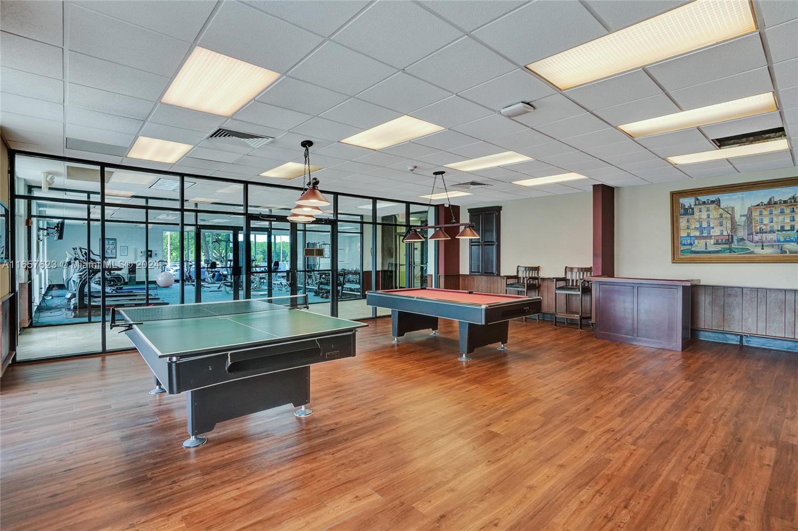 500 Bayview Drive, Unit PH20 Sunny Isles Beach, FL 33160 - Photo 38 of 41 a room with lots of furniture wooden floor and a table