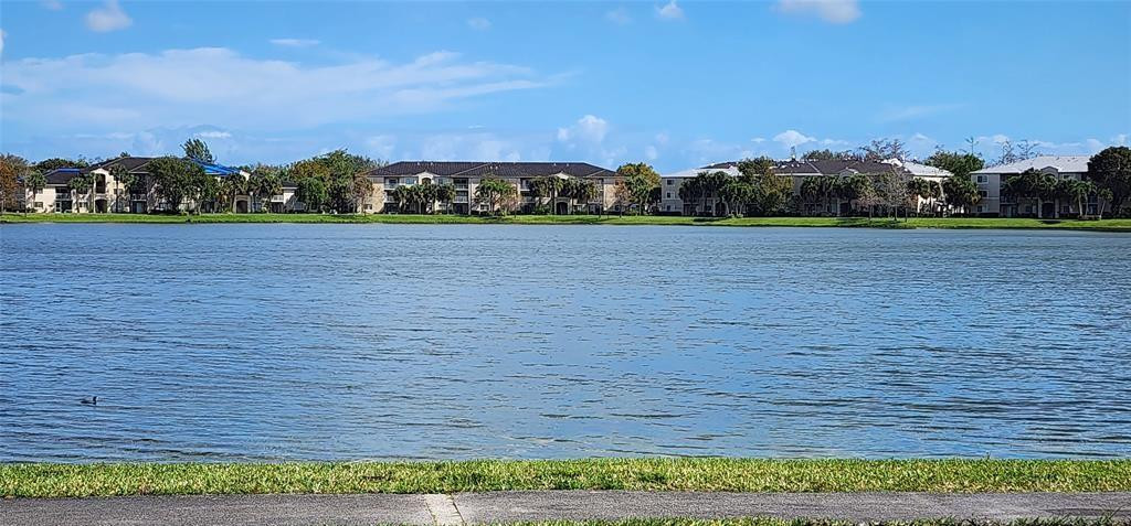 5005 Wiles Road, Unit 106 Coconut Creek, FL 33073 - Photo 5 of 19 a view of house with outdoor space