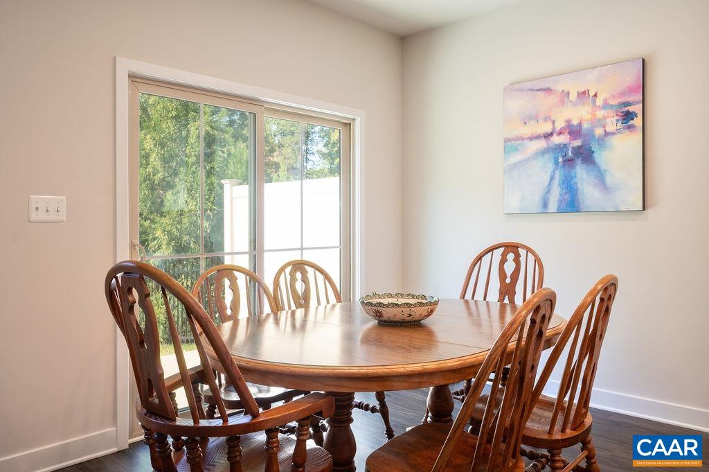 388 Winding Road Keswick, VA 22947 - Photo 8 of 31 a view of a dining room with furniture window and wooden floor