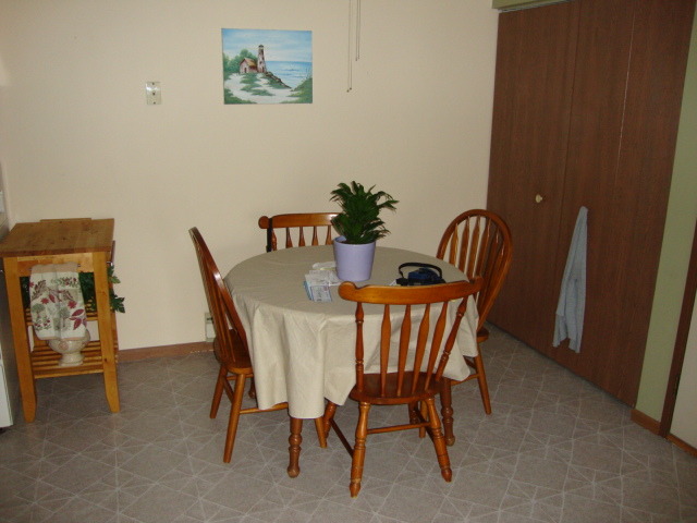 645 South Virginia Road, Unit 224 Crystal Lake, IL 60014 - Photo 7 of 9 a view of a dining room with furniture and wooden floor