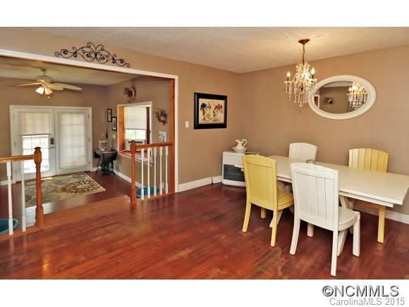 951 Old Clyde Road Clyde, NC 28721 - Photo 7 of 18 a view of a dining room with furniture and wooden floor