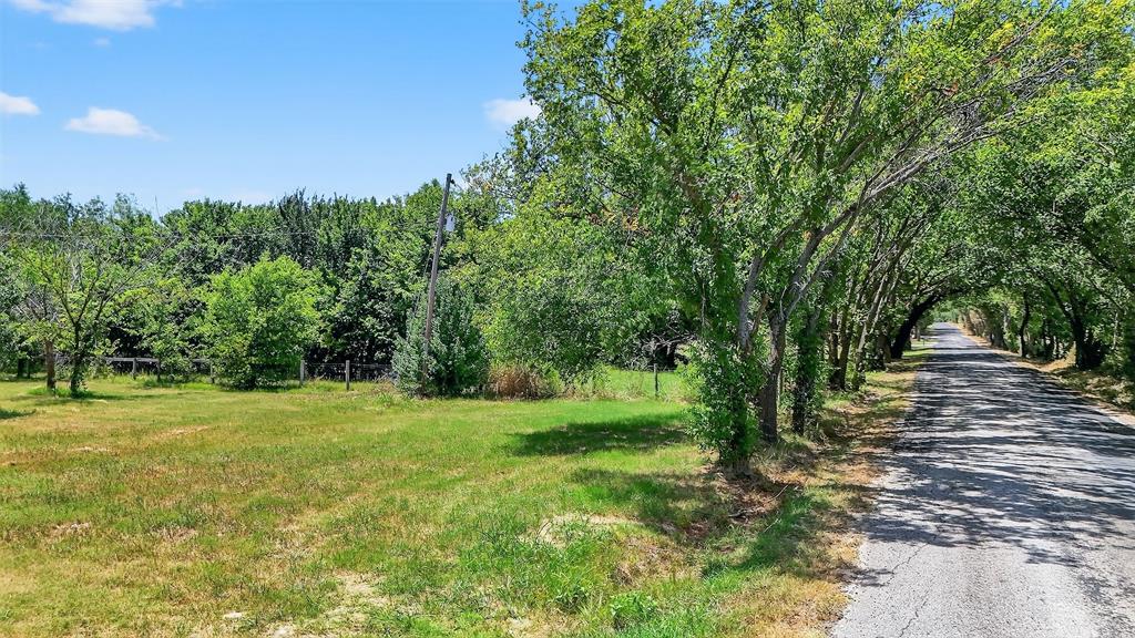 398 Phillips Street Callisburg, TX 76240 - Photo 2 of 22 a view of outdoor space with trees all around