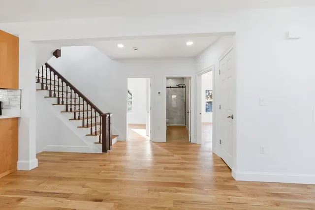 a view of entryway with wooden floor