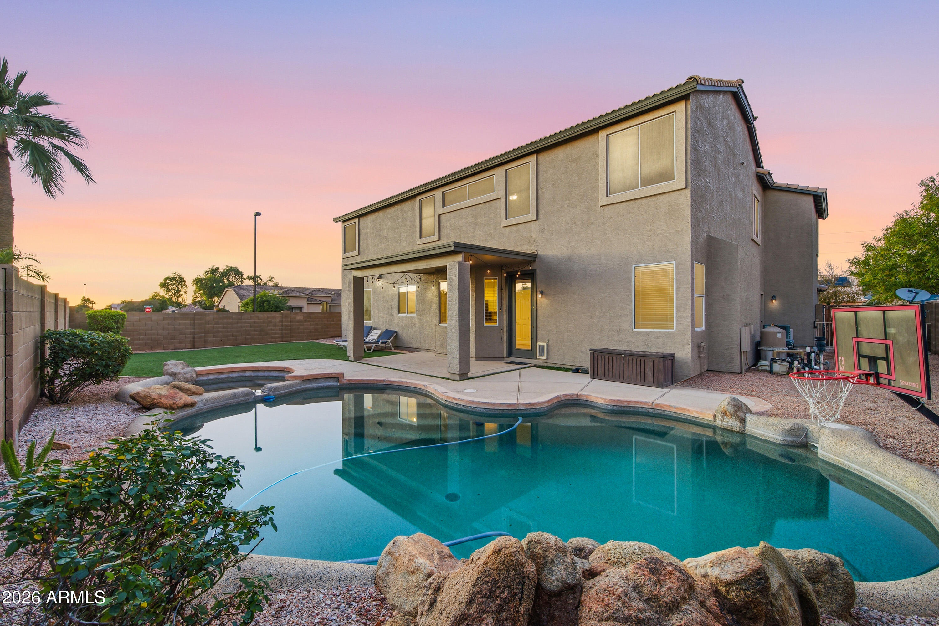 3535 East Derringer Way Gilbert, AZ 85297 - Photo 4 of 37 a view of a house with pool and chairs