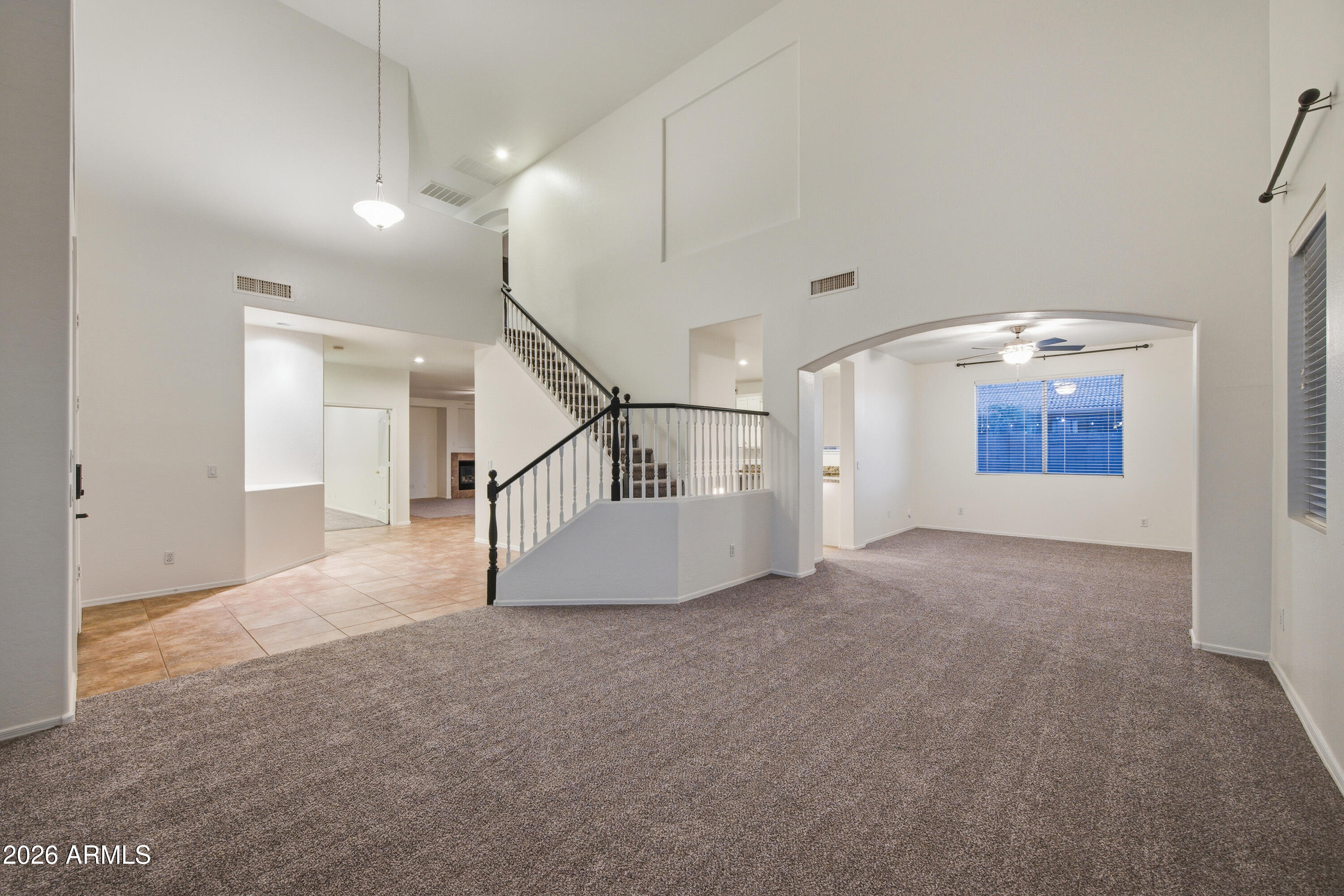 3535 East Derringer Way Gilbert, AZ 85297 - Photo 7 of 37 a view of a hallway with staircase
