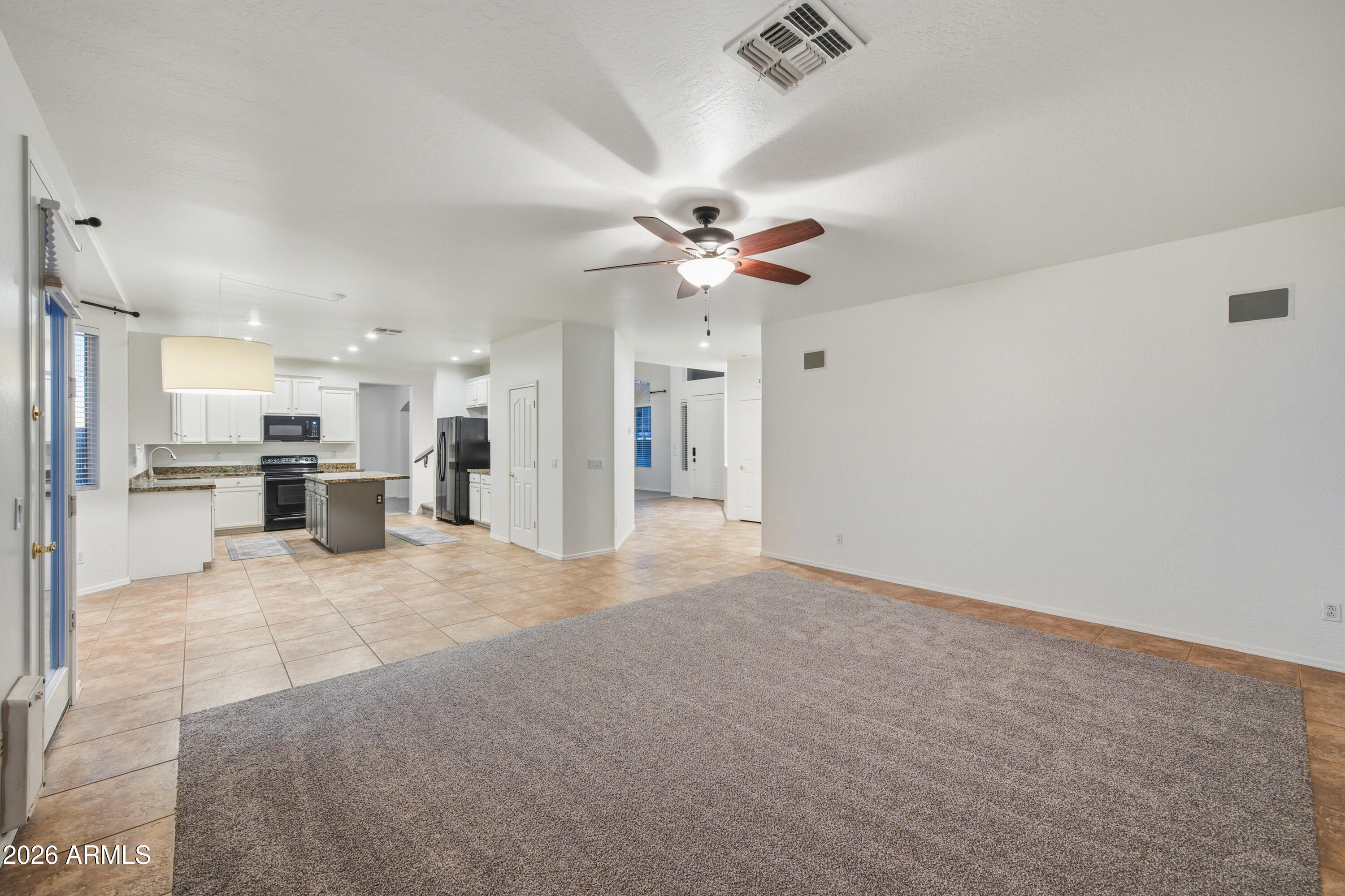 3535 East Derringer Way Gilbert, AZ 85297 - Photo 9 of 37 a view of an empty room with a kitchen