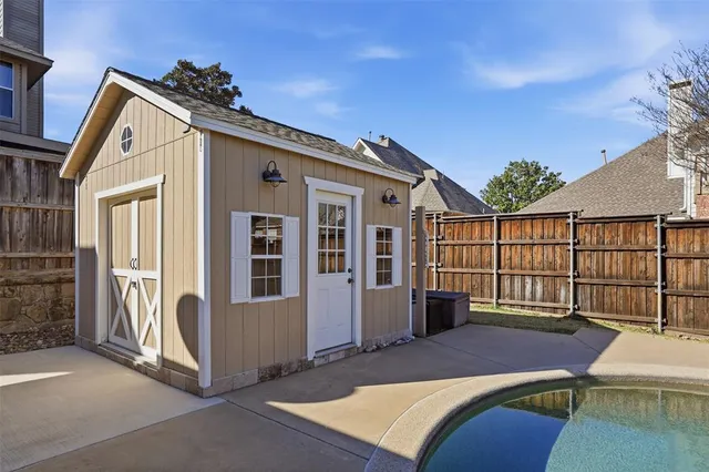 a view of a house with a wooden deck