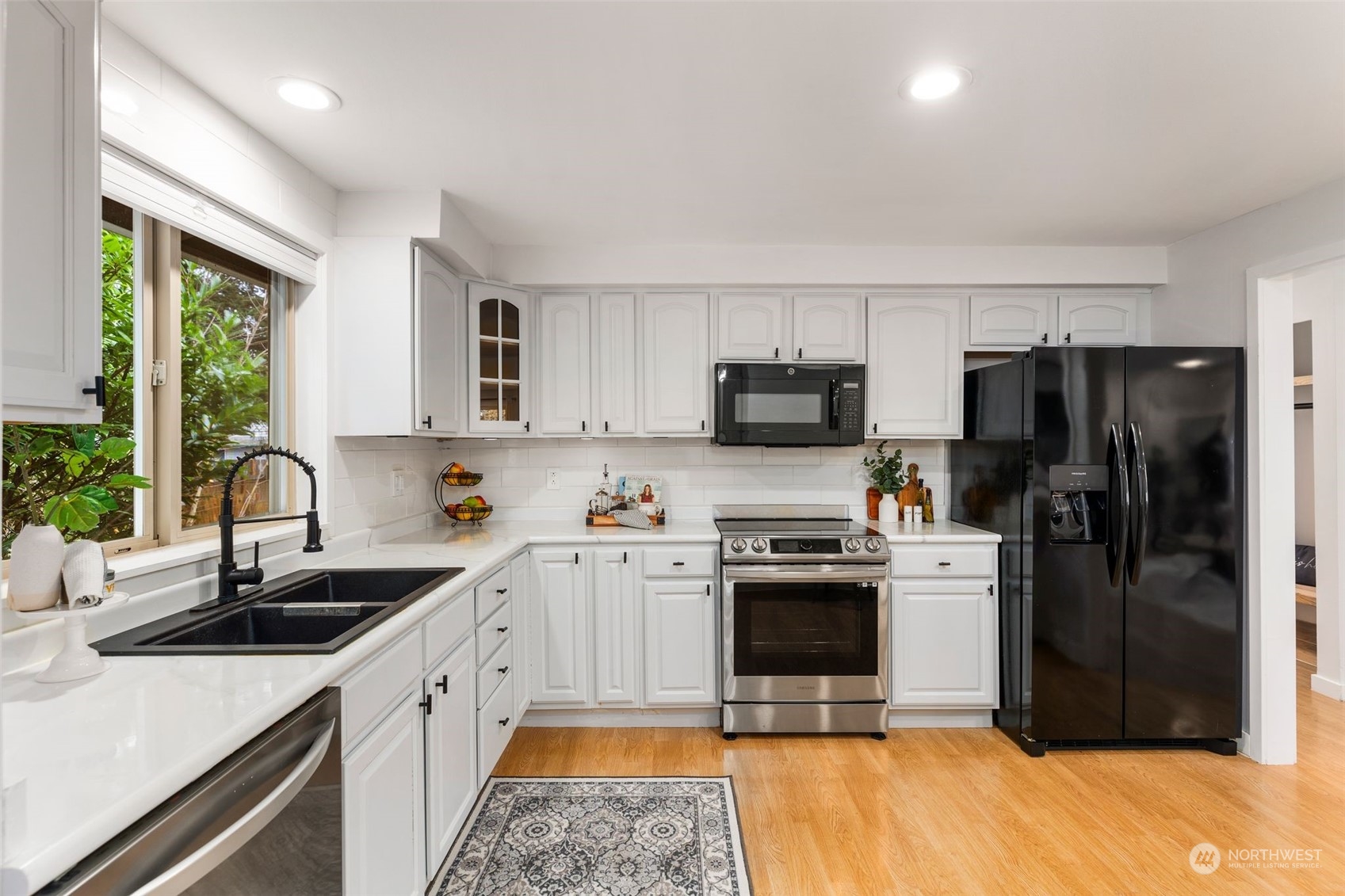 16304 128th Place Southeast Renton, WA 98058 - Photo 12 of 31 a kitchen with a sink stove and refrigerator