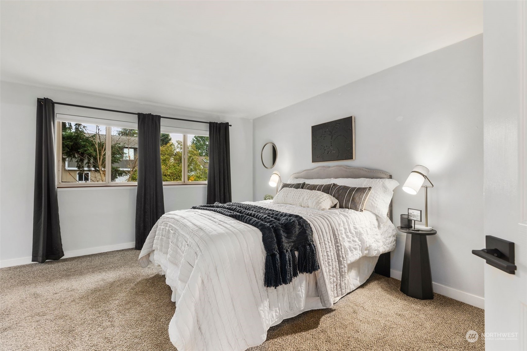 16304 128th Place Southeast Renton, WA 98058 - Photo 15 of 31 a bedroom with a bed and a large window