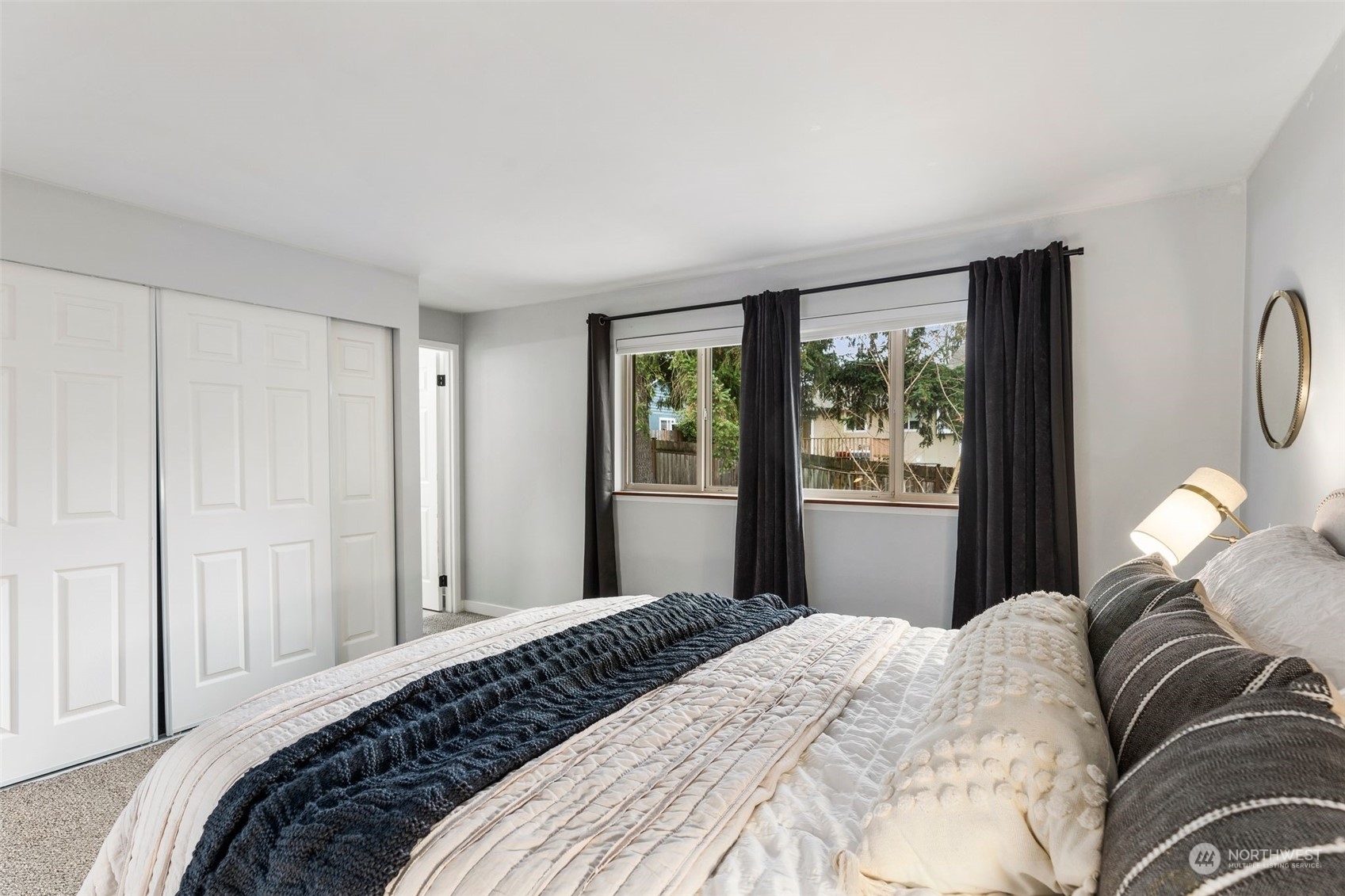 16304 128th Place Southeast Renton, WA 98058 - Photo 16 of 31 a bedroom with a bed lamp and a window
