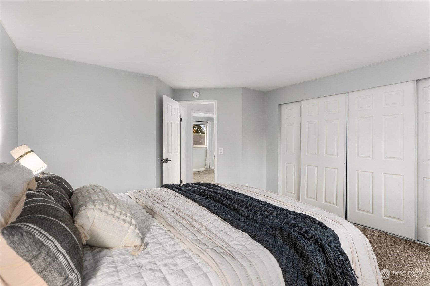 16304 128th Place Southeast Renton, WA 98058 - Photo 17 of 31 a bedroom with a bed and a lamp