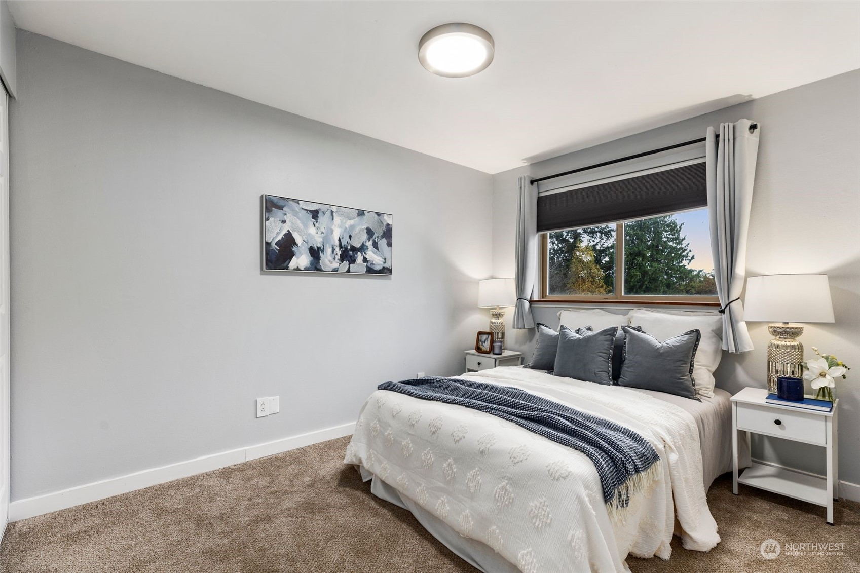 16304 128th Place Southeast Renton, WA 98058 - Photo 19 of 31 a bedroom with a large bed and a window