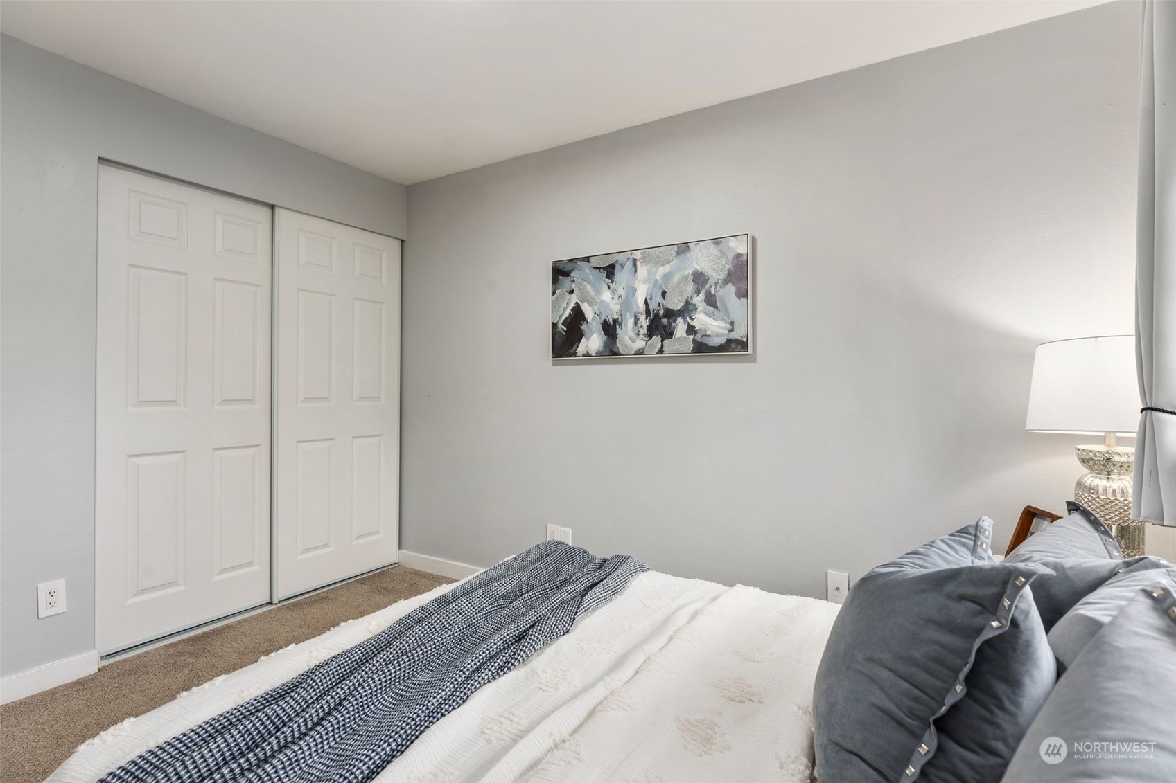 16304 128th Place Southeast Renton, WA 98058 - Photo 20 of 31 a bedroom with a bed and a painting on the wall