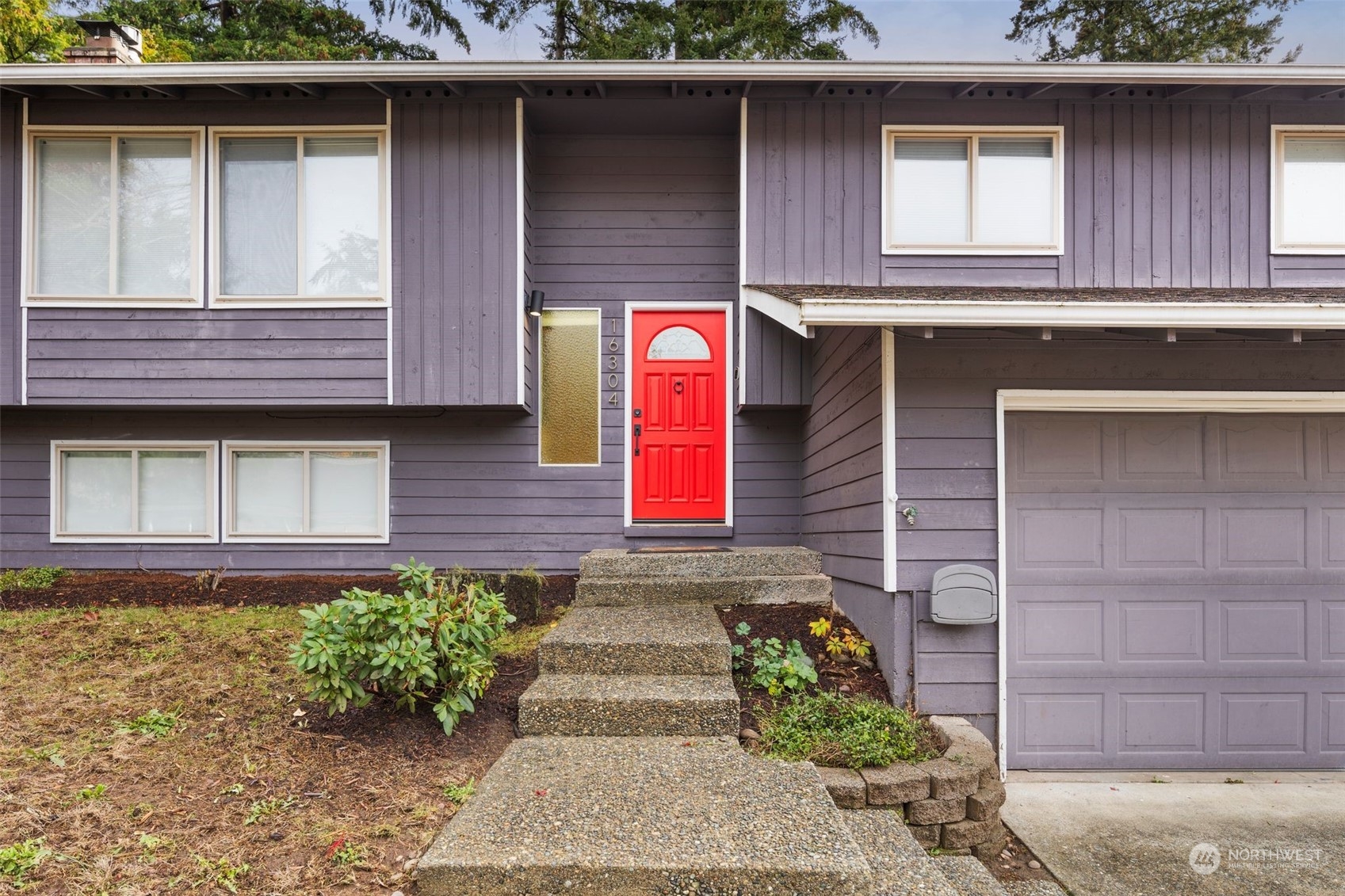 16304 128th Place Southeast Renton, WA 98058 - Photo 2 of 31 a front view of a house with a yard