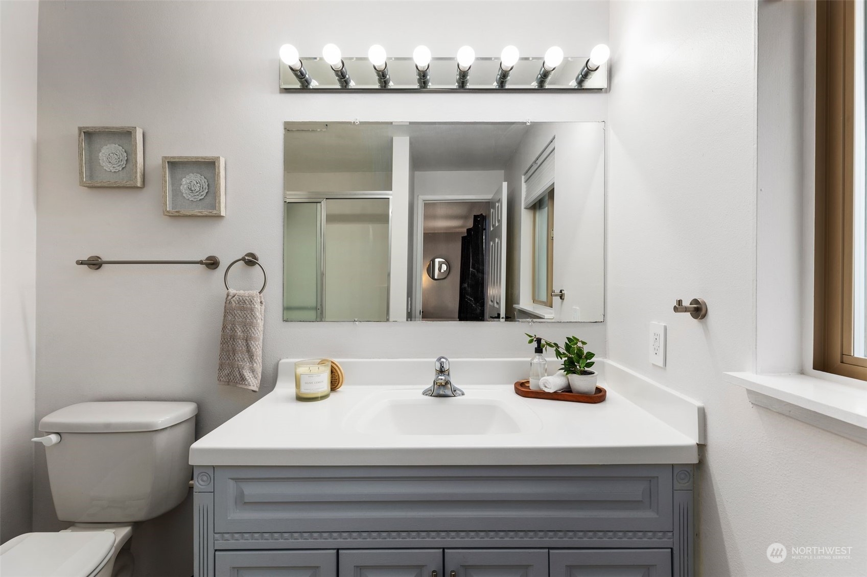 16304 128th Place Southeast Renton, WA 98058 - Photo 21 of 31 a bathroom with a sink vanity mirror and toilet