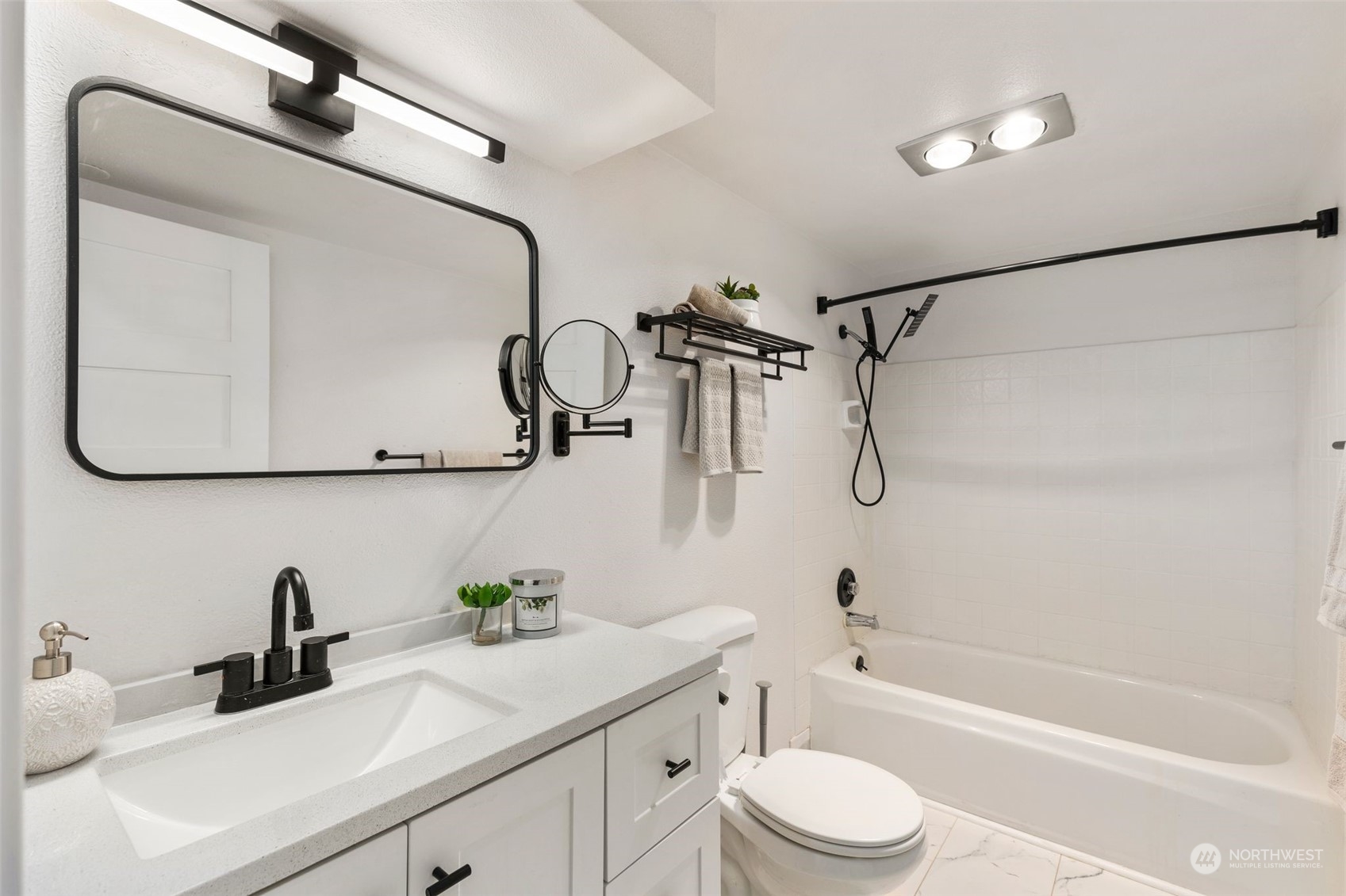 16304 128th Place Southeast Renton, WA 98058 - Photo 24 of 31 a bathroom with a sink a toilet and a mirror