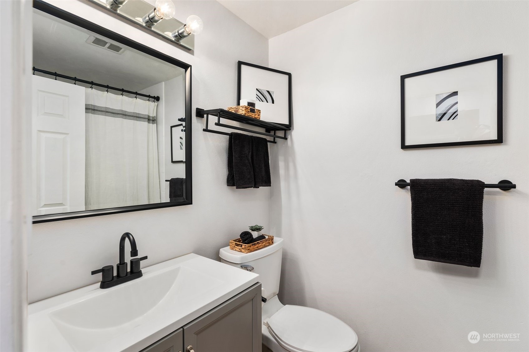 16304 128th Place Southeast Renton, WA 98058 - Photo 26 of 31 a bathroom with a toilet sink and mirror