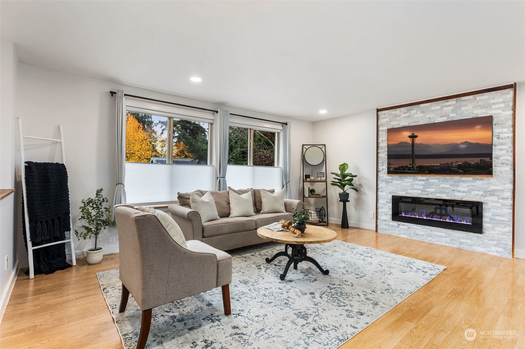 16304 128th Place Southeast Renton, WA 98058 - Photo 4 of 31 a living room with furniture and a fireplace