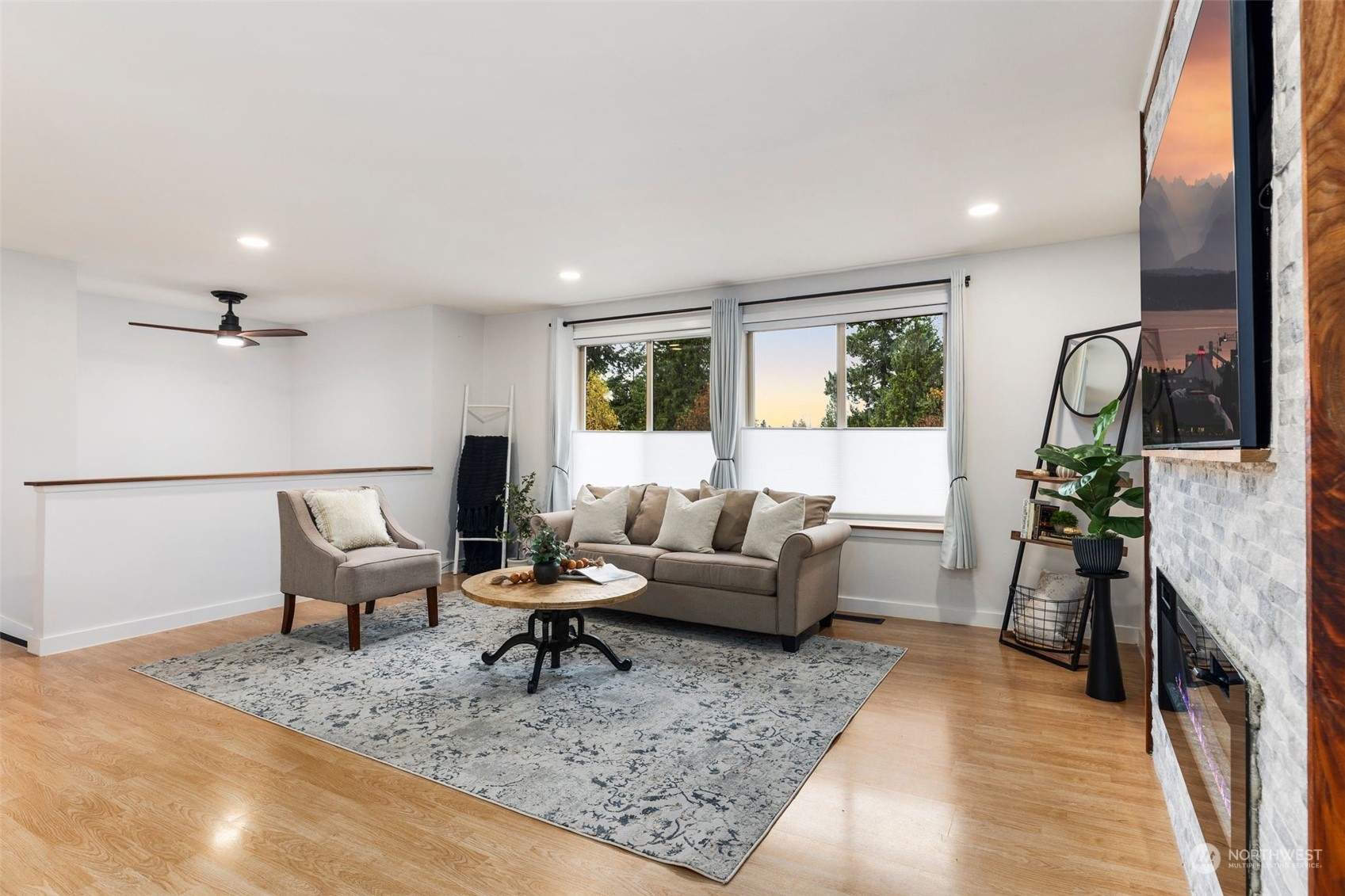 16304 128th Place Southeast Renton, WA 98058 - Photo 6 of 31 a living room with furniture and a rug