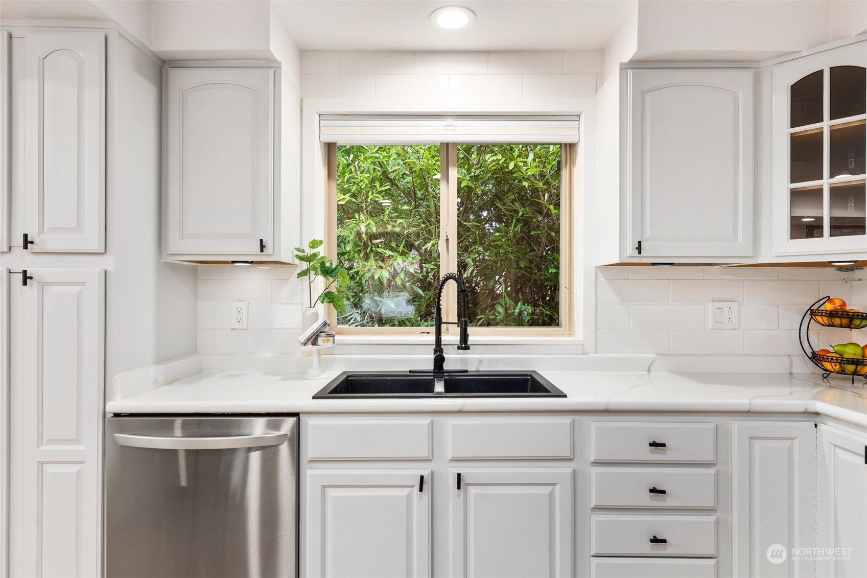 16304 128th Place Southeast Renton, WA 98058 - Photo 10 of 31 a kitchen with a sink and cabinets