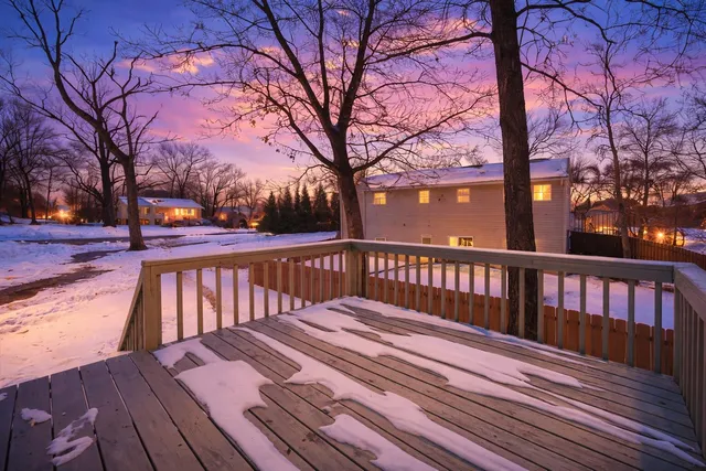 a kitchen with granite countertop white cabinets and stainless steel appliances