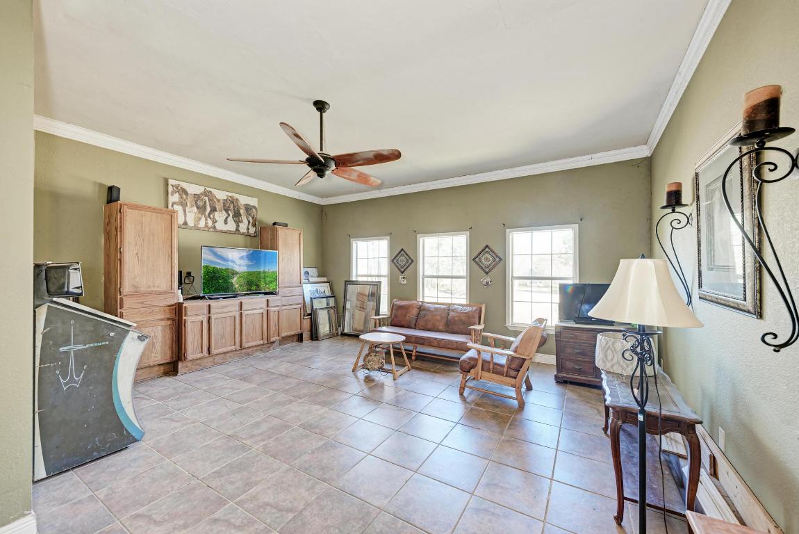321 Navajo Trail Georgetown, TX 78633 - Photo 11 of 40 a living room with furniture and a flat screen tv