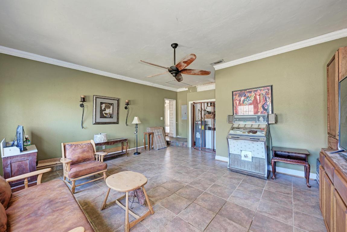 321 Navajo Trail Georgetown, TX 78633 - Photo 12 of 40 a living room with furniture a desk and chair with a bookshelf