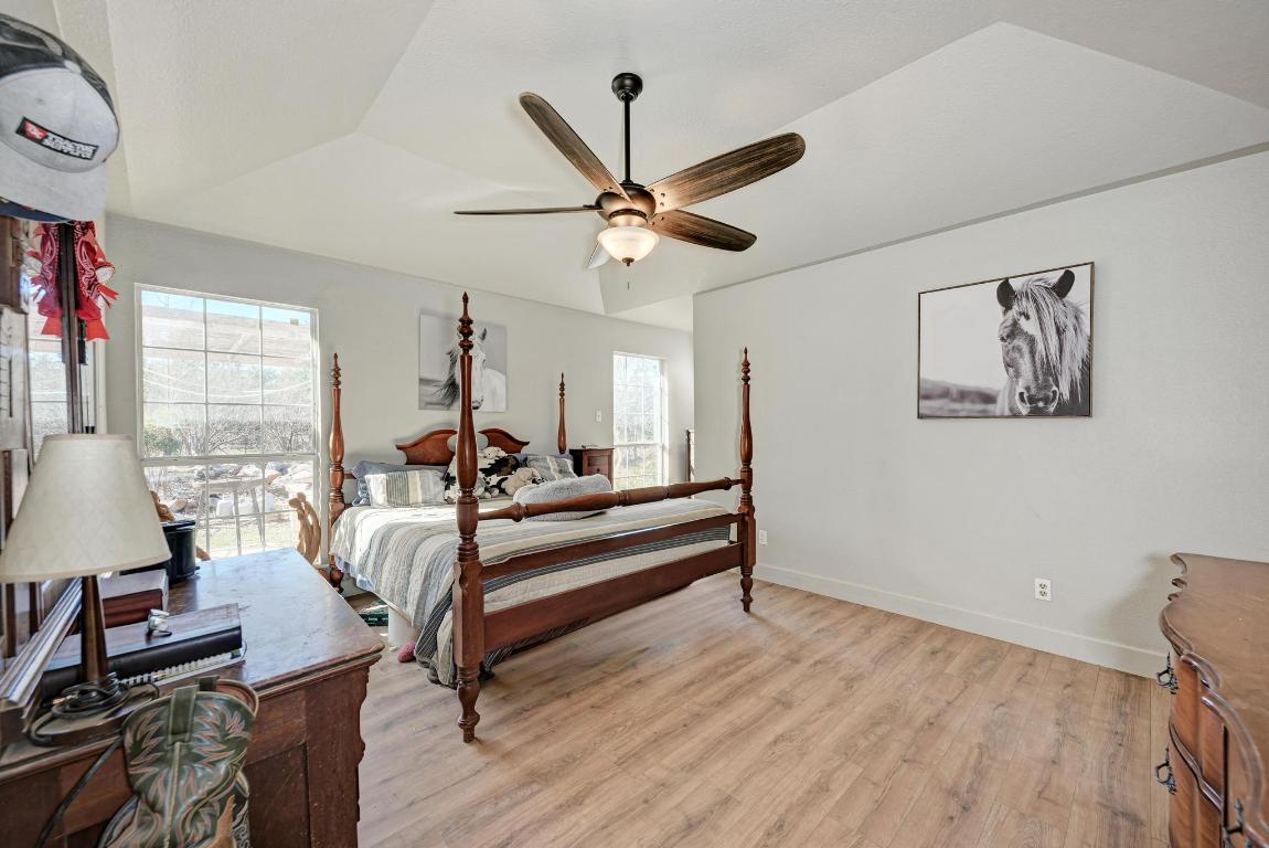321 Navajo Trail Georgetown, TX 78633 - Photo 13 of 40 a view of a livingroom with furniture a ceiling fan and wooden floor