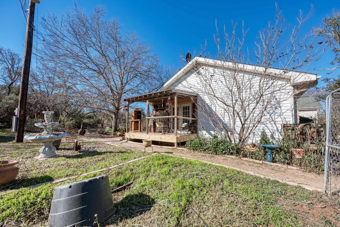 321 Navajo Trail Georgetown, TX 78633 - Photo 22 of 40 a view of a house with a yard covered in snow
