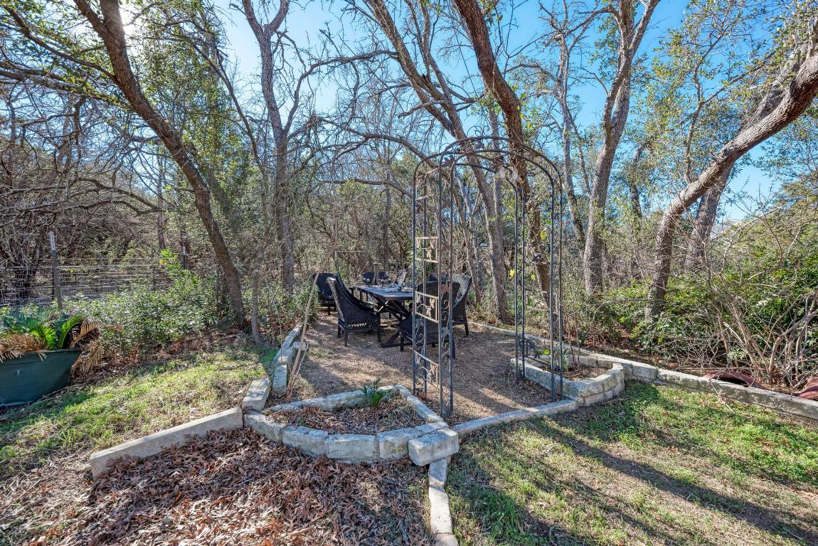 321 Navajo Trail Georgetown, TX 78633 - Photo 28 of 40 a view of a backyard with sitting area