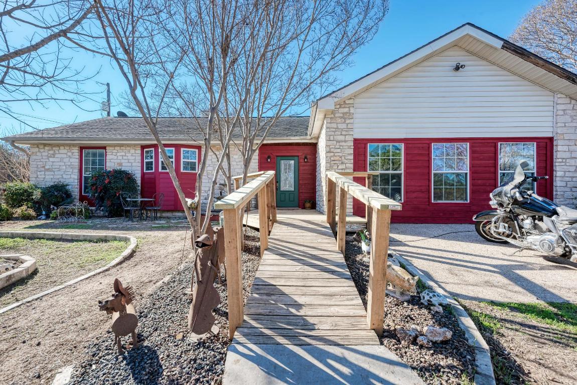 321 Navajo Trail Georgetown, TX 78633 - Photo 5 of 40 a front view of a house with garden