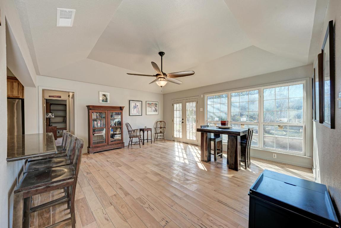 321 Navajo Trail Georgetown, TX 78633 - Photo 7 of 40 a view of a dining room with furniture window and wooden floor