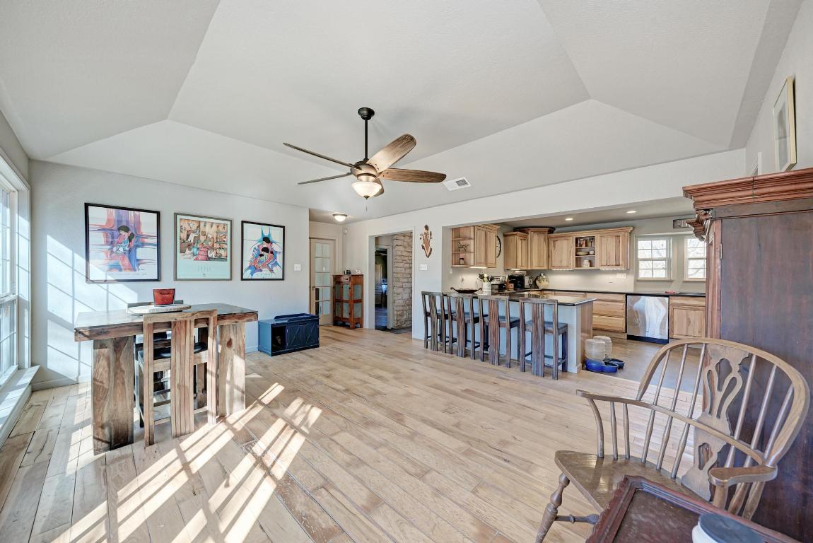321 Navajo Trail Georgetown, TX 78633 - Photo 8 of 40 a view of a dining room with furniture a kitchen and chandelier