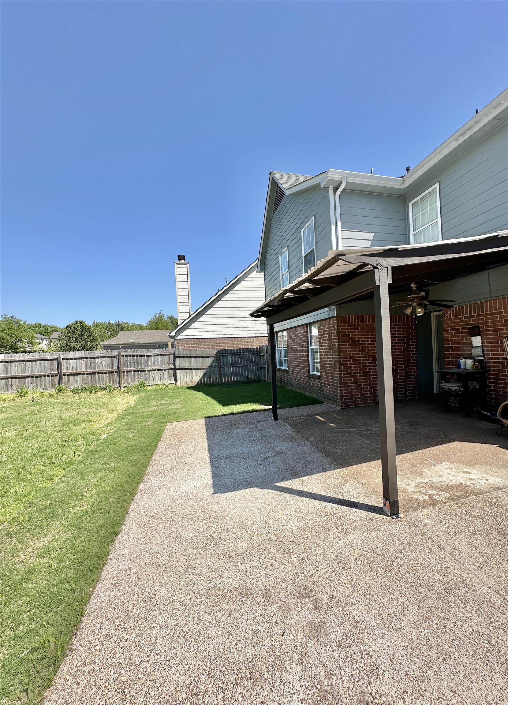 10006 Cameron Ridge Trail Memphis, TN 38016 - Photo 28 of 29 a view of a house with a yard